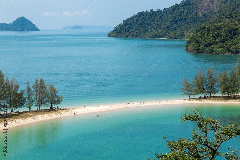 White sand beach and Long-tail boat at Kham-Tok Island (koh-kam-tok), The beautiful sea Ranong Province, Thailand.