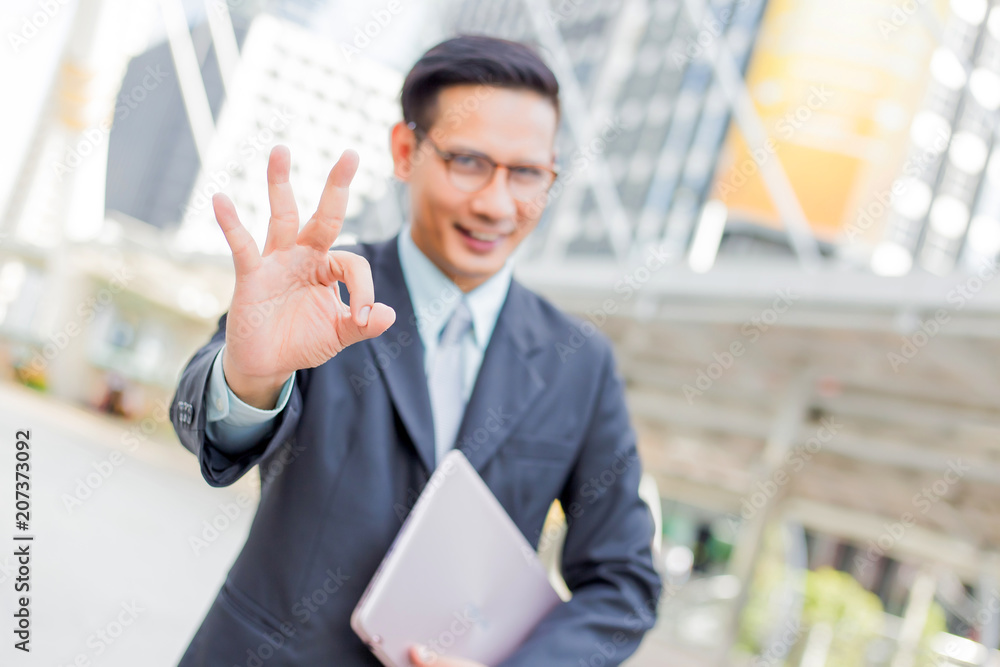 Happy young businessman make okay gesture. okay symbol. Happy young businessman make okay gesture. okay symbol.