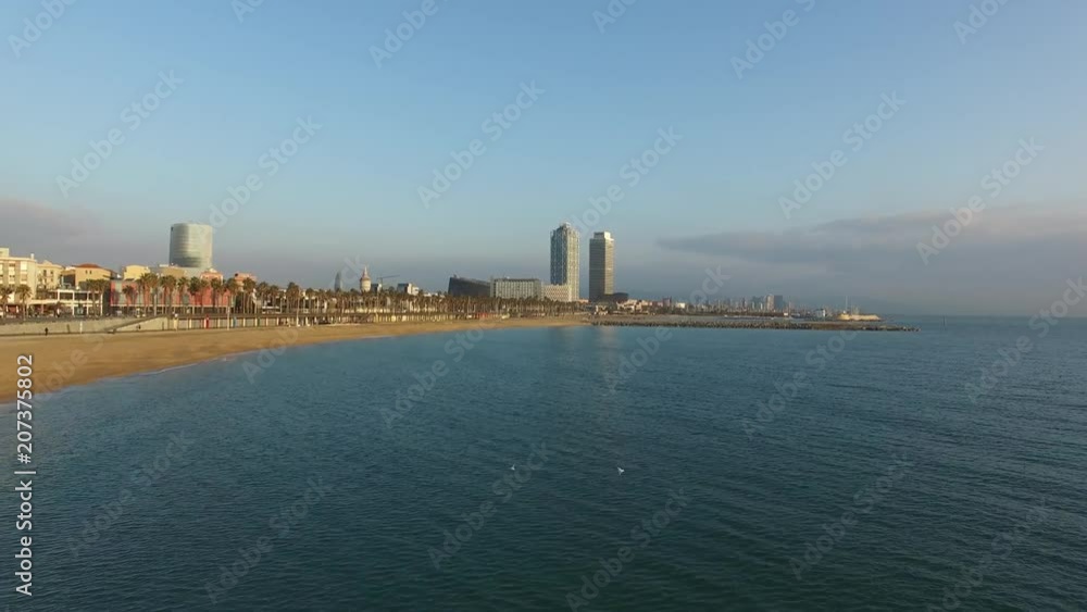 Sunny drone shot of Barcelona beach at sunrise Sunny drone shot of Barcelona beach at sunrise