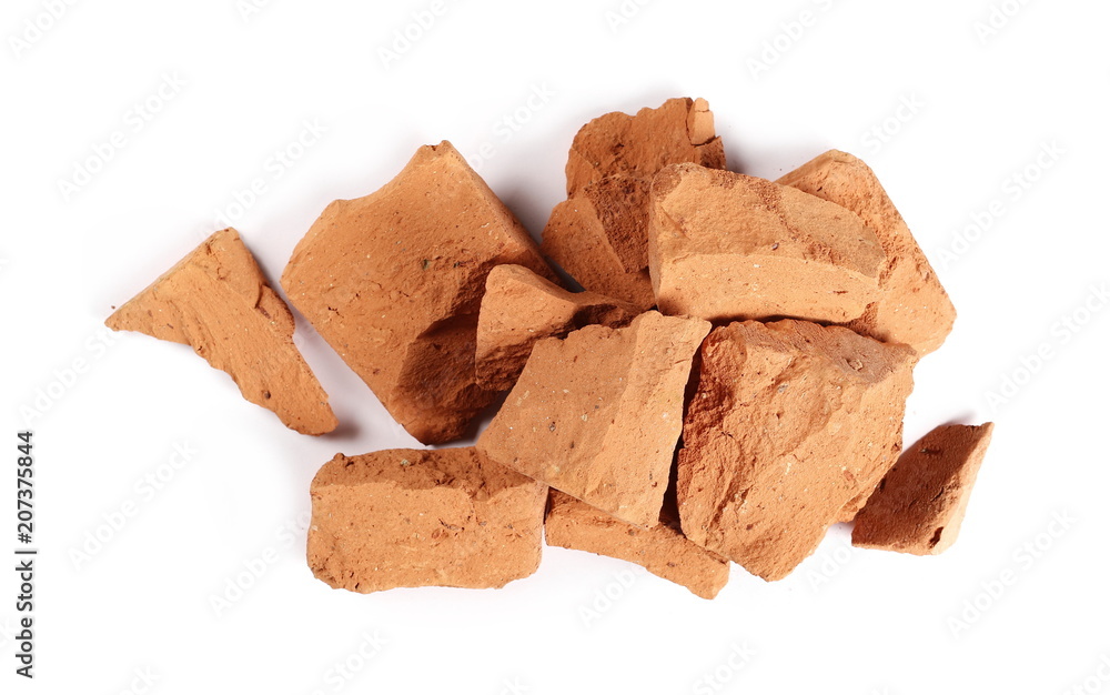 Shattered brick pieces isolated on white background, top view Shattered brick pieces isolated on white background, top view