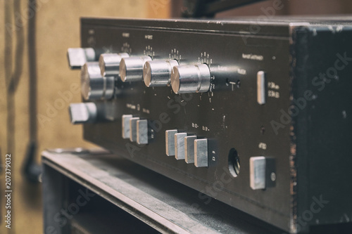 Vászonkép Old stereo amplifier in black with silver handles