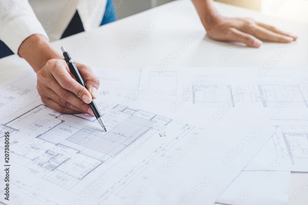 Workplace items tools for project, Architect or Engineer working on blueprint for architectural project in progress, construction and structure concept Workplace items tools for project, Architect or Engineer working on blueprint for architectural project in progress, construction and structure concept
