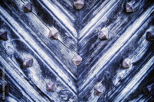 blue background of old wooden doors with metal elements