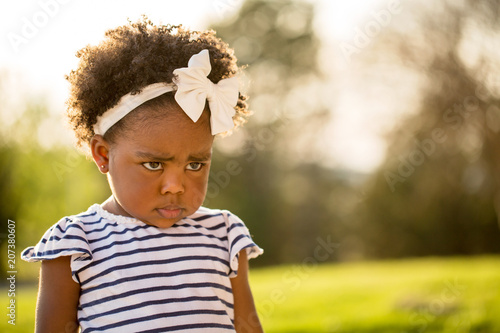 Billede på lærred African American little girl with a mad expression.