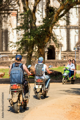 BAGAN, MYANMAR - DECEMBER 1, 2016: Mopeds on a city street. Vertical. Copy space for text.
