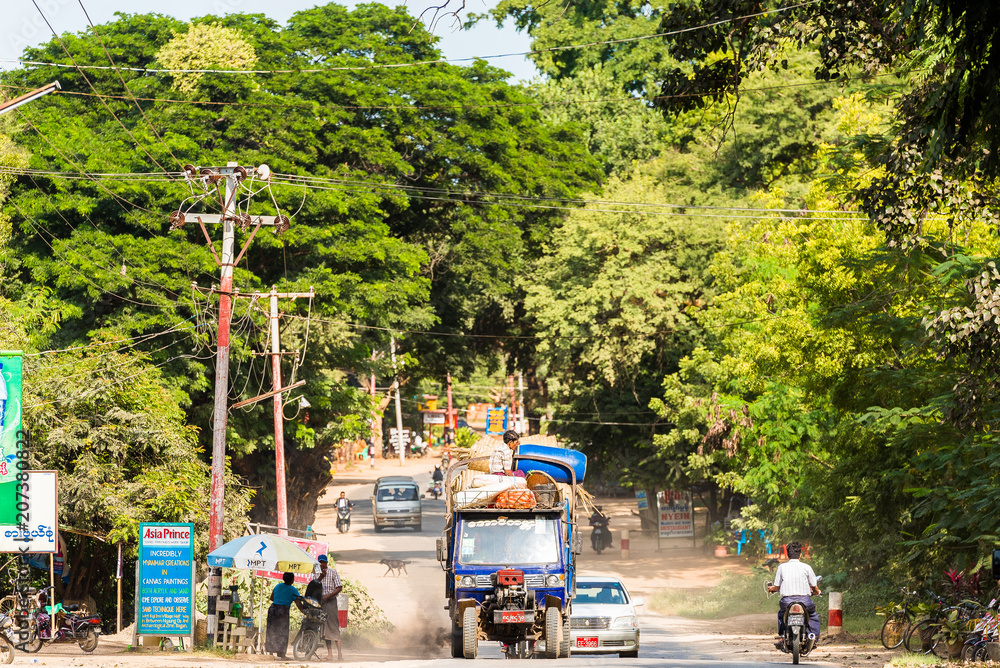 BAGAN, MYANMAR - DECEMBER 1, 2016: City landscape. Transport on the road. Copy space for text.