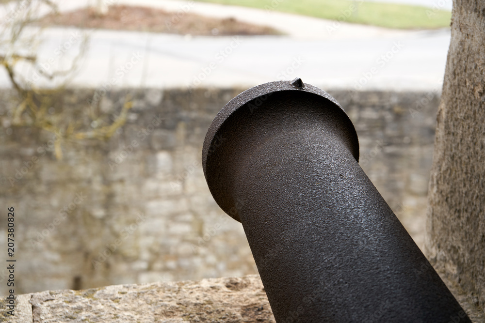 Closeup of a cannon barrel from a medieval wall. Closeup of a cannon barrel from a medieval wall.