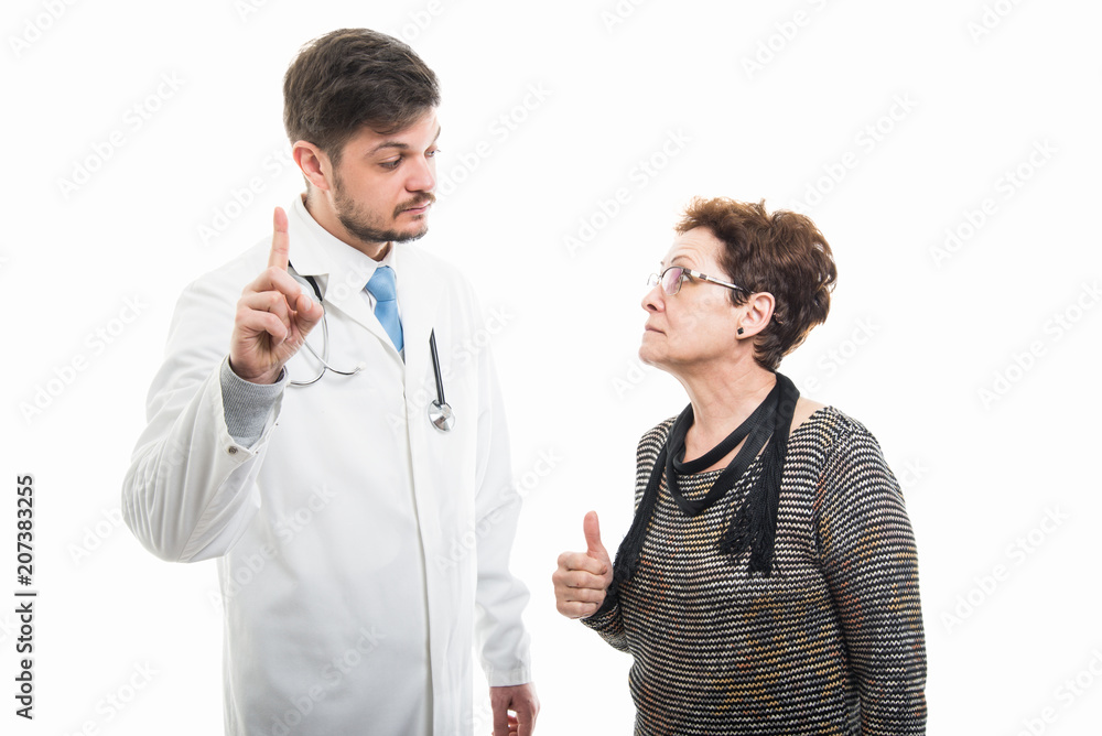 Male doctor and senior female patient showing one Male doctor and senior female patient showing one