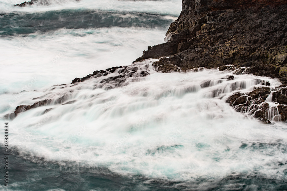 The wild Atlantic Ocean crashes against the rocks along the Western shore of Shetland Islands at Eshaness The wild Atlantic Ocean crashes against the rocks along the Western shore of Shetland Islands at Eshaness