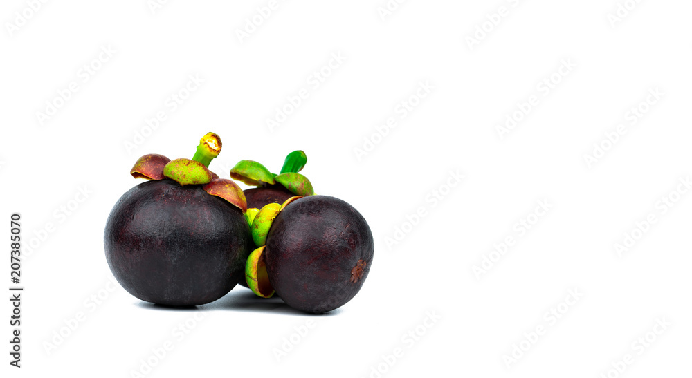 Whole mangosteen showing purple skin isolated on white background with space. Tropical fruit from Thailand. The queen of fruits. Asia fresh fruit market concept. Natural source of tannin and xanthones Whole mangosteen showing purple skin isolated on white background with space. Tropical fruit from Thailand. The queen of fruits. Asia fresh fruit market concept. Natural source of tannin and xanthones