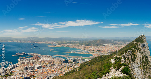 Panoramic view of Gibraltar Rock, Gibraltar town and bay. Gibraltar is British Overseas Territory in South West Europe. 