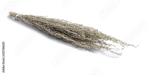 Dried medicinal herbs raw materials isolated on white. Artemisia absinthium.