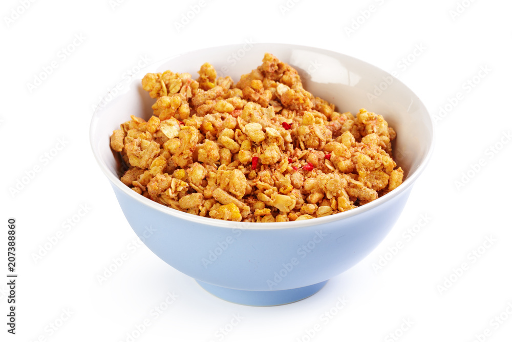 Bowl of homemade granola with fruit pieces isolated on white Bowl of homemade granola with fruit pieces isolated on white