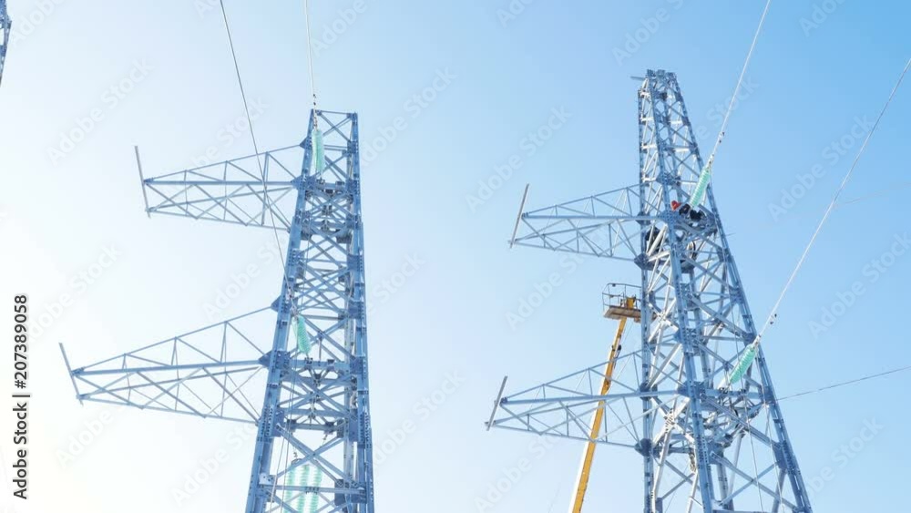 transmission towers and crane ground with employee transmission towers and crane ground with employee