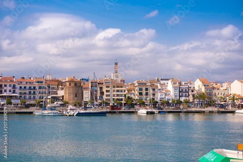 CAMBRILS, SPAIN - APRIL 30, 2017: View of port and city waterfront with Church Of Saint Peter in middle and Torre del Port. Copy space for text. © ggfoto