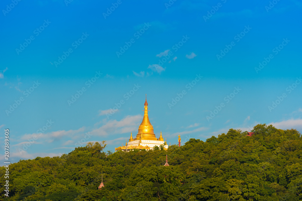 MANDALAY, MYANMAR - DECEMBER 1, 2016: Golden Pagoda in Sagaing hill, Burma. Copy space for text.