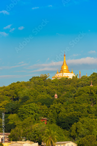 MANDALAY  MYANMAR - DECEMBER 1  2016  Golden Pagoda in Sagaing hill Burma. Copy space for text. Vertical.