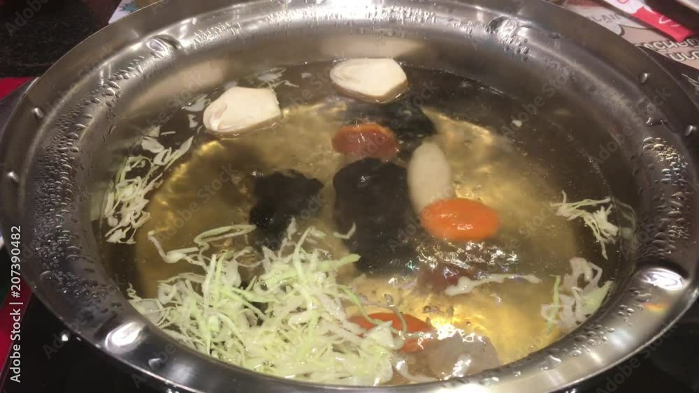 Filling variety meat and vegetable to boiling delicious sukiyaki, Thai style at restaurant Filling variety meat and vegetable to boiling delicious sukiyaki, Thai style at restaurant