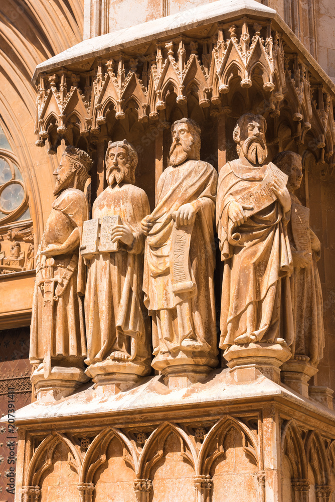 TARRAGONA, SPAIN – MAY 1, 2017: Cathedral (Catholic cathedral). Sculptures on the facade of the building. Close-up. Vertical.