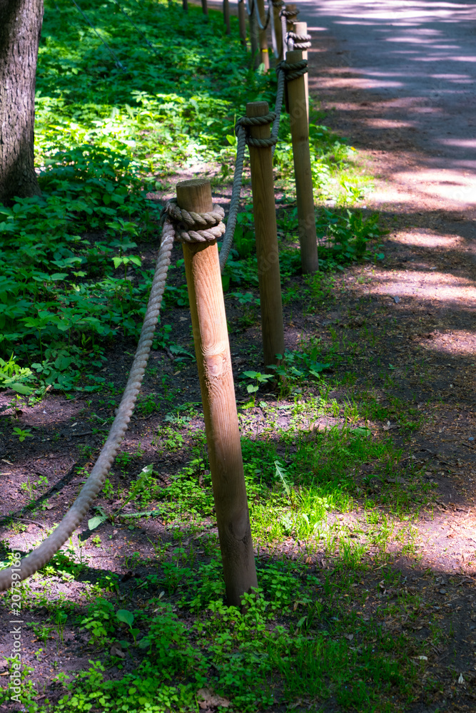Fototapeta premium fence of the rope in the park