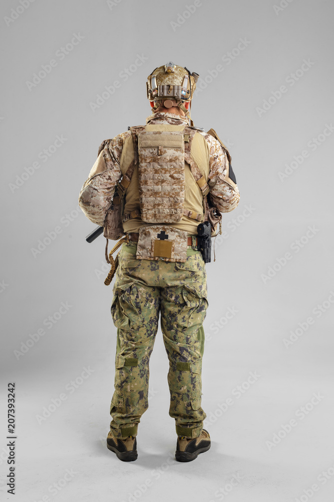 Special forces soldier with rifle on white background. Special forces soldier with rifle on white background.