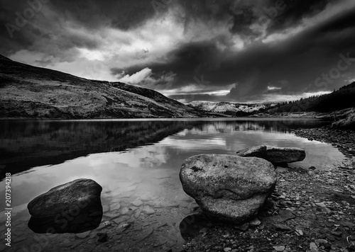 Dovestone Rocks and water, moody skies black and white