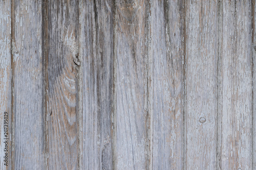 Texture of old wooden planks with natural pattern and light paint residue, abstract grunge retro background   