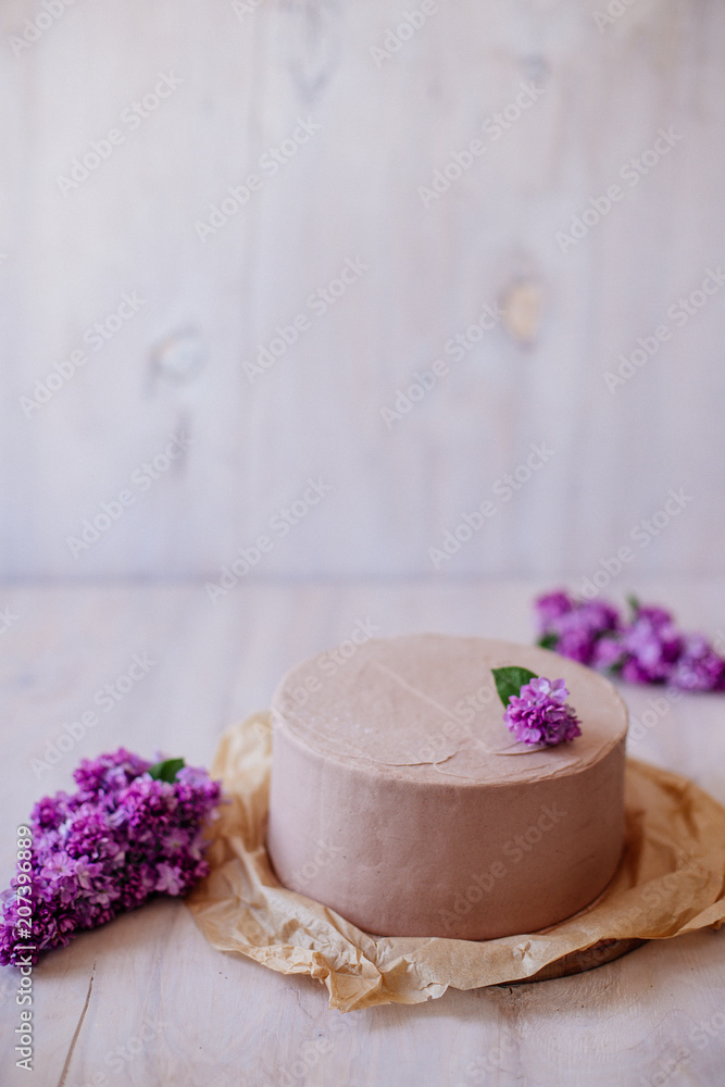 Chocolate cake with lilac decor. Chocolate cake with lilac decor.