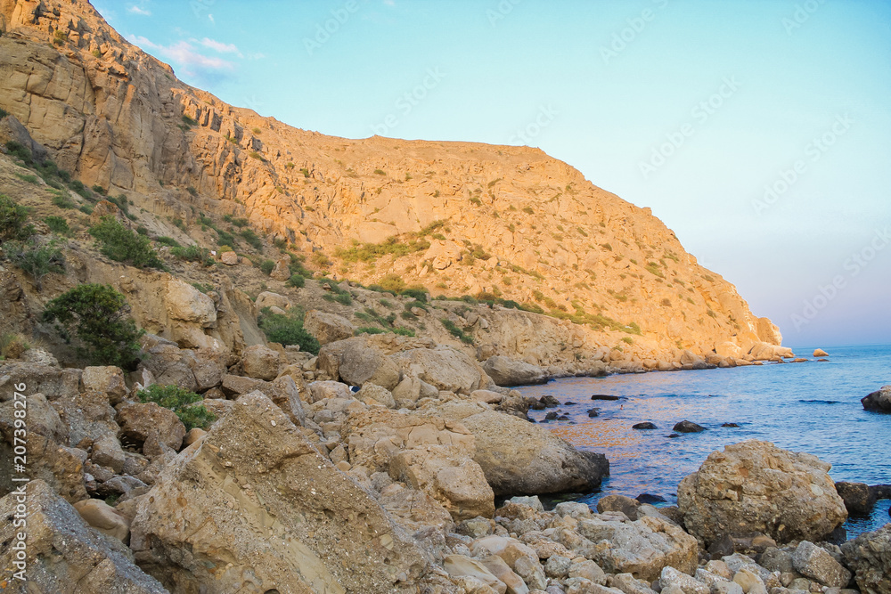 Sea and rocks landscape at Cape Meganom, the east coast of the peninsula of Crimea. Colorful background. Travelling concept. Copy space.