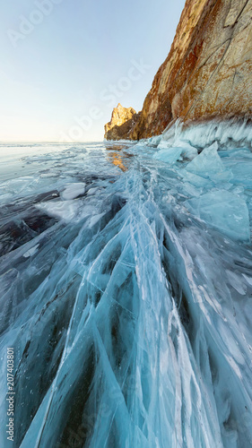 rock in the ice of Lake Baikal, the island of Olkhon. Panorama landscape, abstraction photo