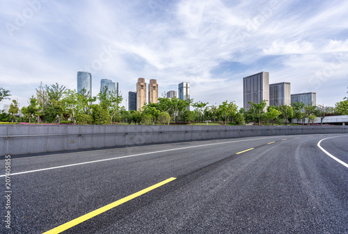 city skyline with asphalt road