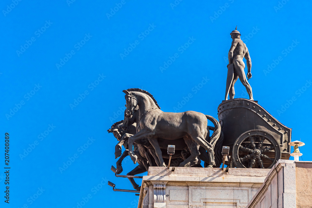MADRID, SPAIN - SEPTEMBER 26, 2017: Sculpture of a chariot, over a bank building on the street Alcala. Copy space for text.