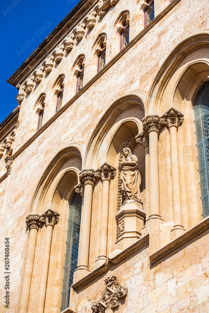 TARRAGONA, SPAIN - OCTOBER 4, 2017: View of the facade of the building of the Tarragona Cathedral (Catholic cathedral) on a sunny day. Vertical.