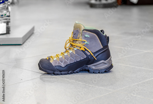 Hiking mountain boots , trekking and hiking equipment footwear for outdoor mountain trails on the floor store