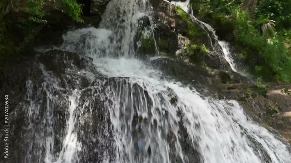 Waterfall in mountains at summer, natural outdoor travel concept