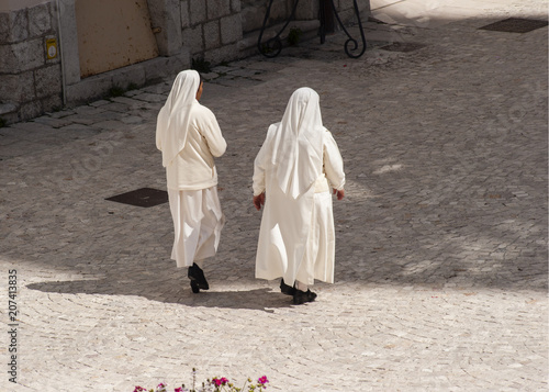 nuns walking in the monastery.