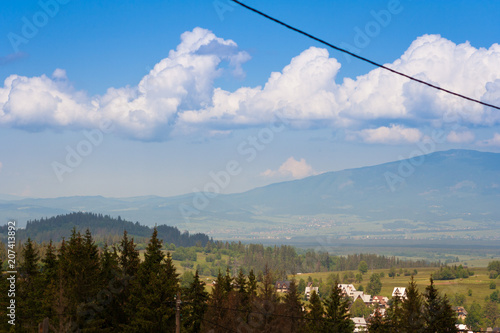 Inspiring Mountains Landscape Panorama, beautiful day in summer Tatras, mountain ridge over blue sky in Zakopane, Poland
