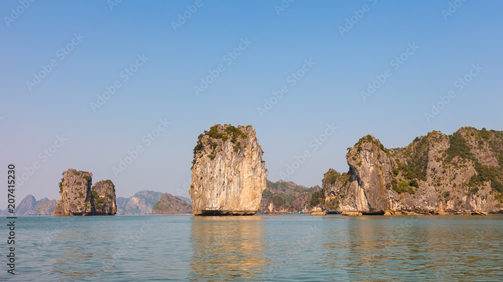 Ha Long Bay in North Vietnam. The bay features thousands of limestone karsts and isles in various shapes and sizes. Ha Long Bay in North Vietnam. The bay features thousands of limestone karsts and isles in various shapes and sizes.