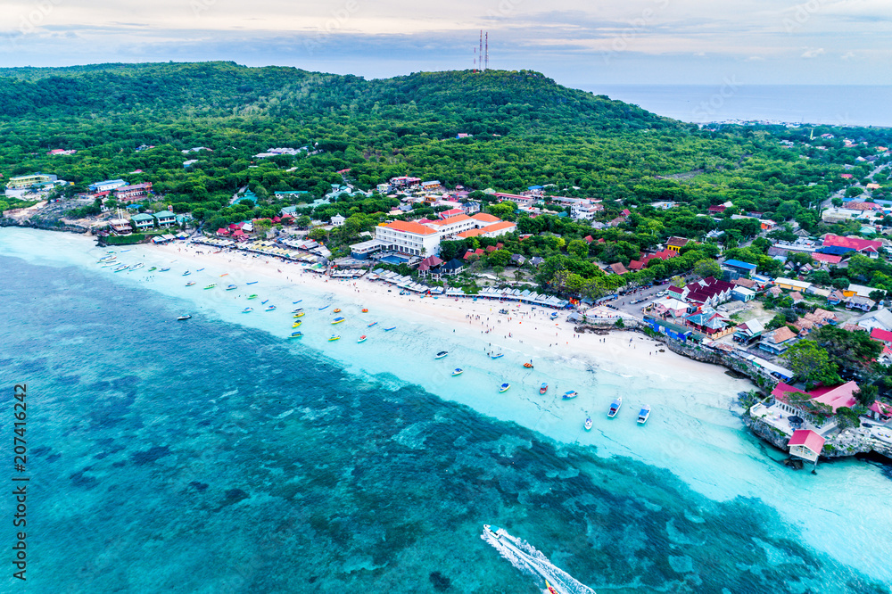 Aerial View of Tanjung Bira Beach, Sandy Beach with Tourists Swimming in Beautiful Clear Sea Water, South Sulawesi Indonesia