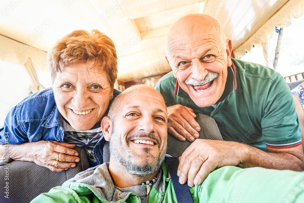 Senior happy couple with son taking selfie at boat trip in Laos - Adventure travel in south east asia - Elderly and family concept of love sharing moments with parents - Warm vintage filtered look Senior happy couple with son taking selfie at boat trip in Laos - Adventure travel in south east asia - Elderly and family concept of love sharing moments with parents - Warm vintage filtered look