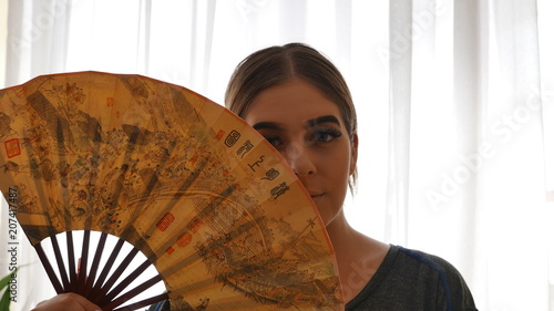 peep - Cute girl with chinese fan