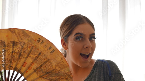 good news! - Cute girl with chinese fan