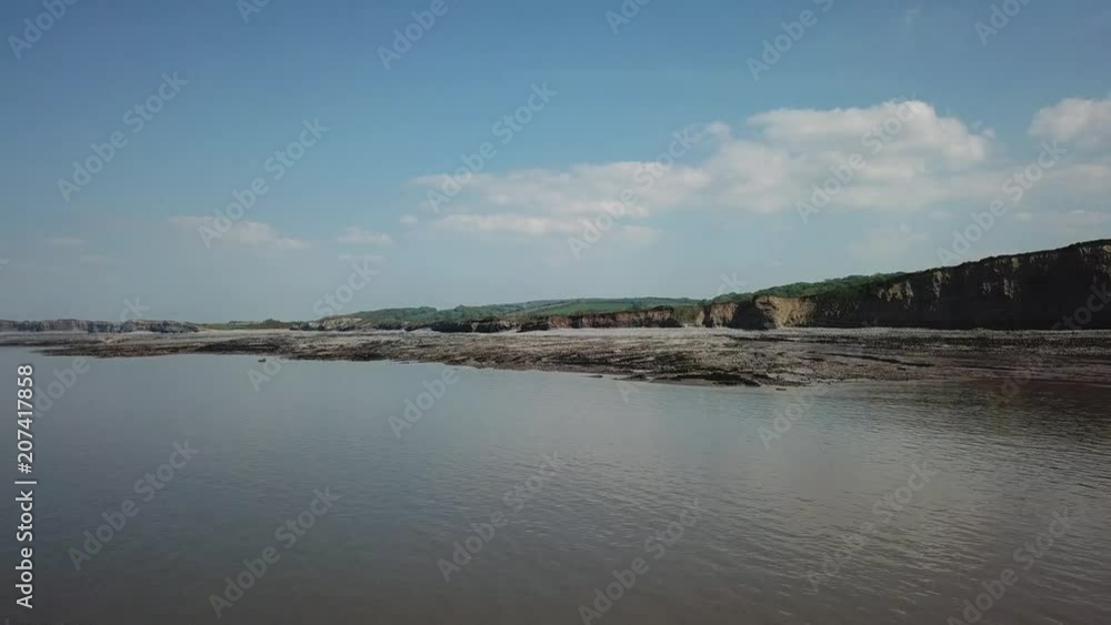 Aerial of Rocky Jurrasic beach near Kilve Somerset England with many fossils flying over the cliffs Aerial of Rocky Jurrasic beach near Kilve Somerset England with many fossils flying over the cliffs