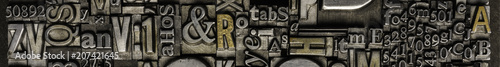 Metal Letterpress Types.
A background from many historical typography letters in black and white with white background.