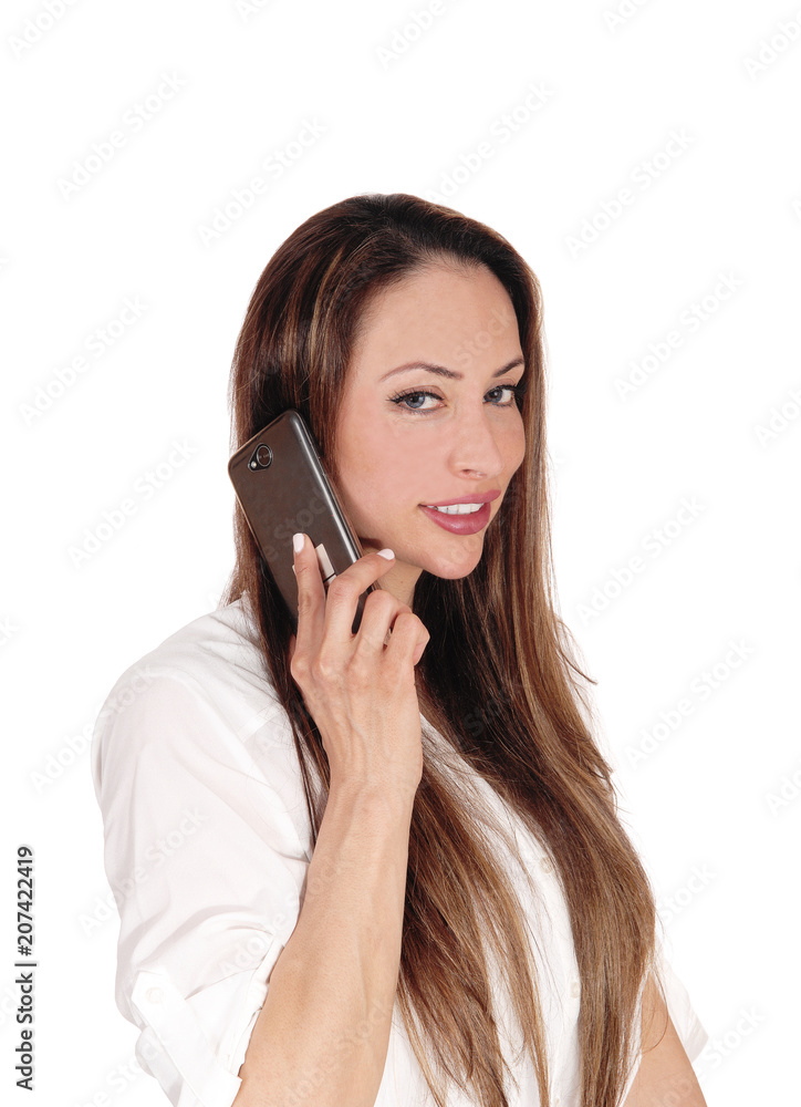 Beautiful woman talking on her cell phone Beautiful woman talking on her cell phone