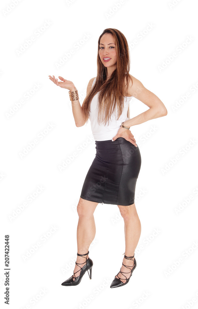 Tall woman standing with one hand offering Tall woman standing with one hand offering