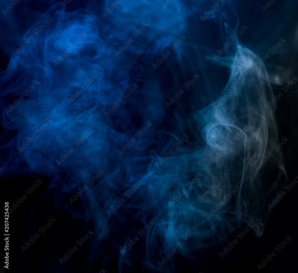 Obraz premium Abstract blue smoke on a dark background