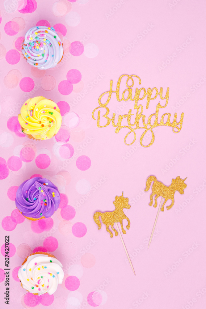Creative pastel fantasy holiday card with cupcake, happy birthday lettering and unicorn. Baby shower, birthday, celebration concept. Creative pastel fantasy holiday card with cupcake, happy birthday lettering and unicorn. Baby shower, birthday, celebration concept.