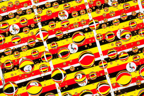 Rain drops full of Uganda flags