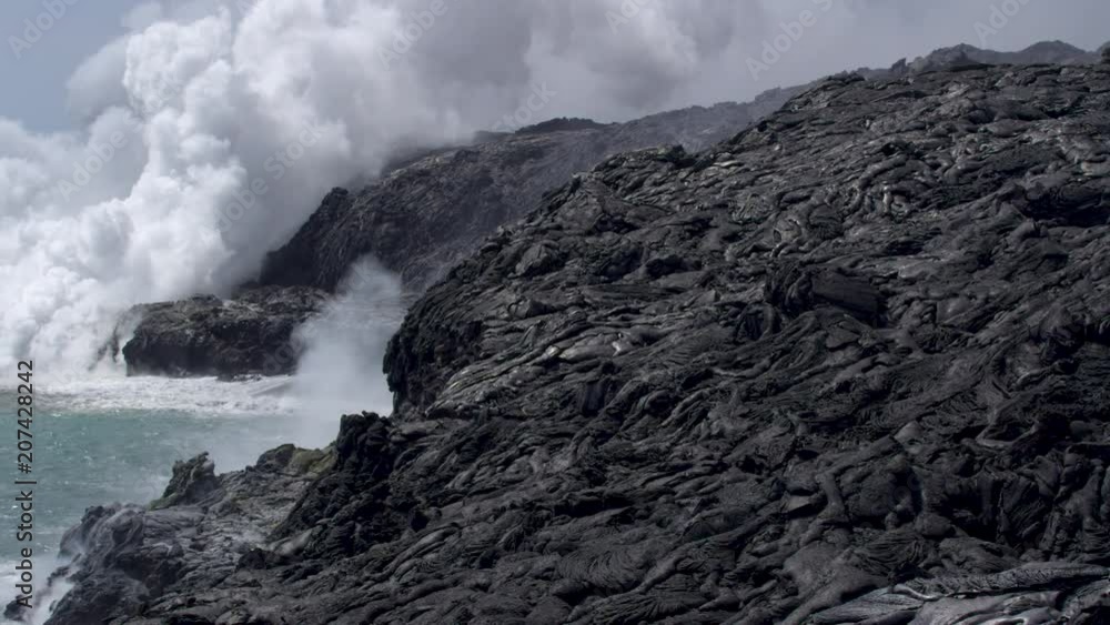 Pan Over of Lava Field and Lava Entering Ocean Hawaii Pan Over of Lava Field and Lava Entering Ocean Hawaii